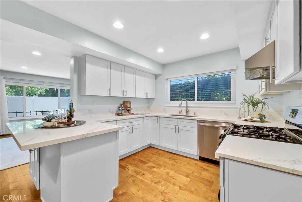 1528 North Gilbert Street Fullerton, CA 92833 - Photo 19 of 40 a kitchen with a sink stove and cabinets