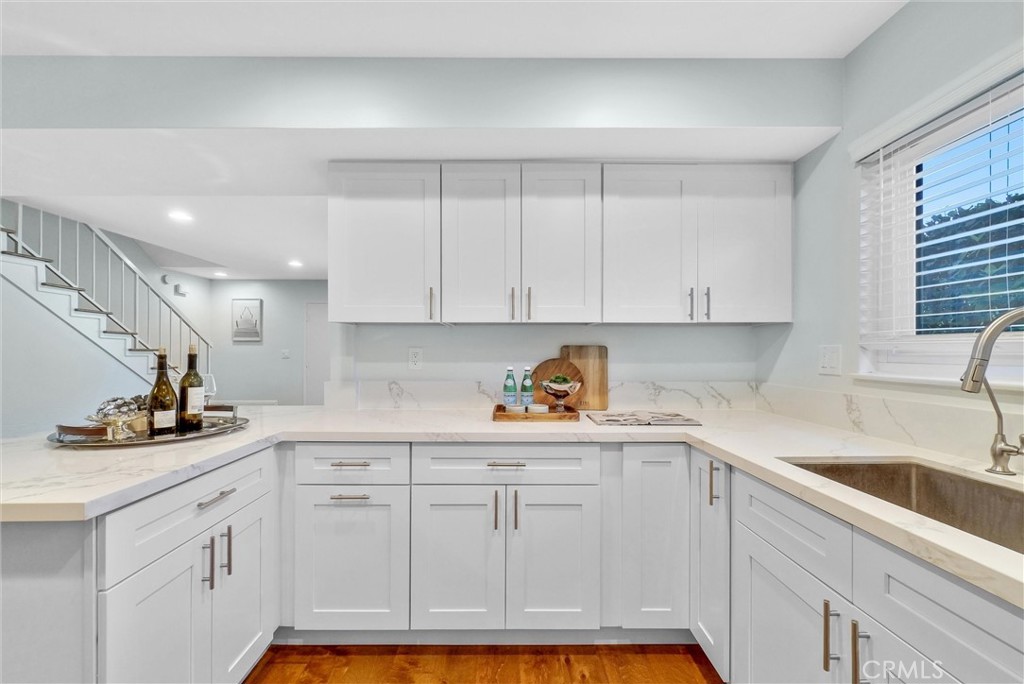 1528 North Gilbert Street Fullerton, CA 92833 - Photo 20 of 40 a kitchen with white cabinets and sink