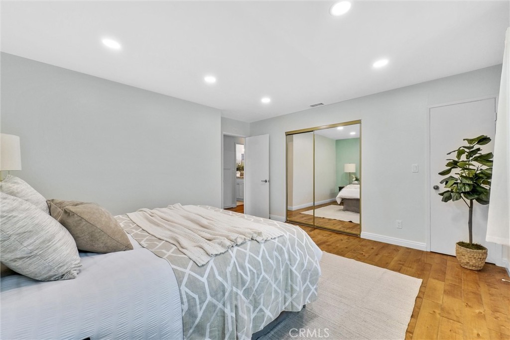 1528 North Gilbert Street Fullerton, CA 92833 - Photo 30 of 40 a bedroom with a bed and a potted plant