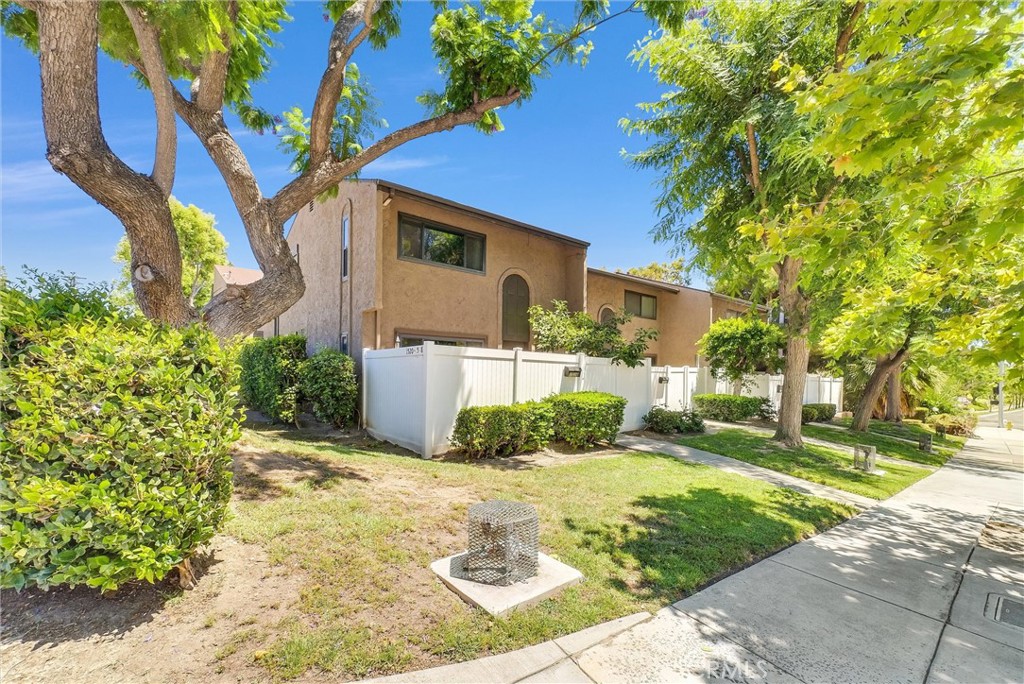 1528 North Gilbert Street Fullerton, CA 92833 - Photo 3 of 40 a front view of a house with a yard