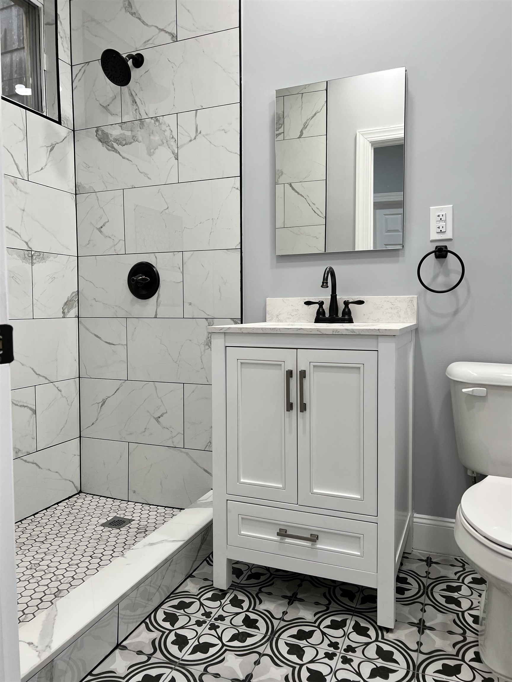 326 70th Street Guttenberg, NJ 07093 - Photo 9 of 15 a bathroom with a sink a toilet and shower