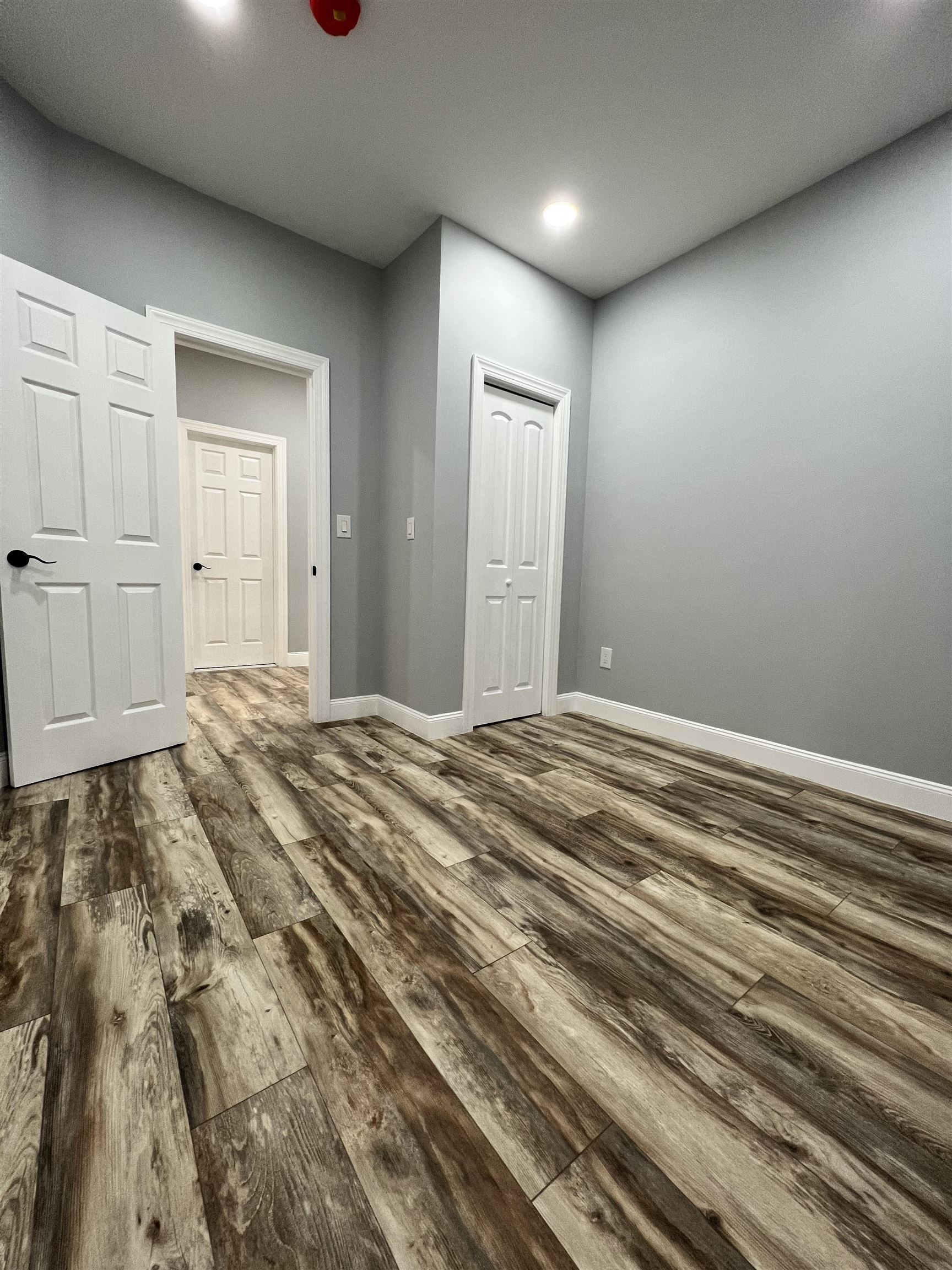 326 70th Street Guttenberg, NJ 07093 - Photo 10 of 15 a bedroom with a bed and cabinets