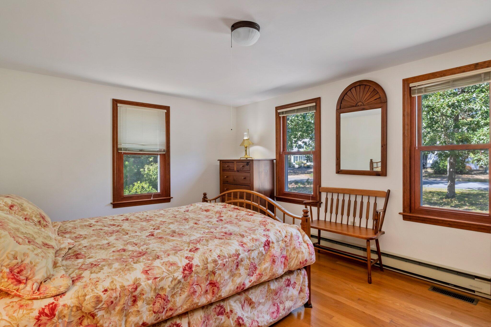 15 Chipmunk Lane Eastham, MA 02642 - Photo 12 of 32 a bedroom with a bed and a window