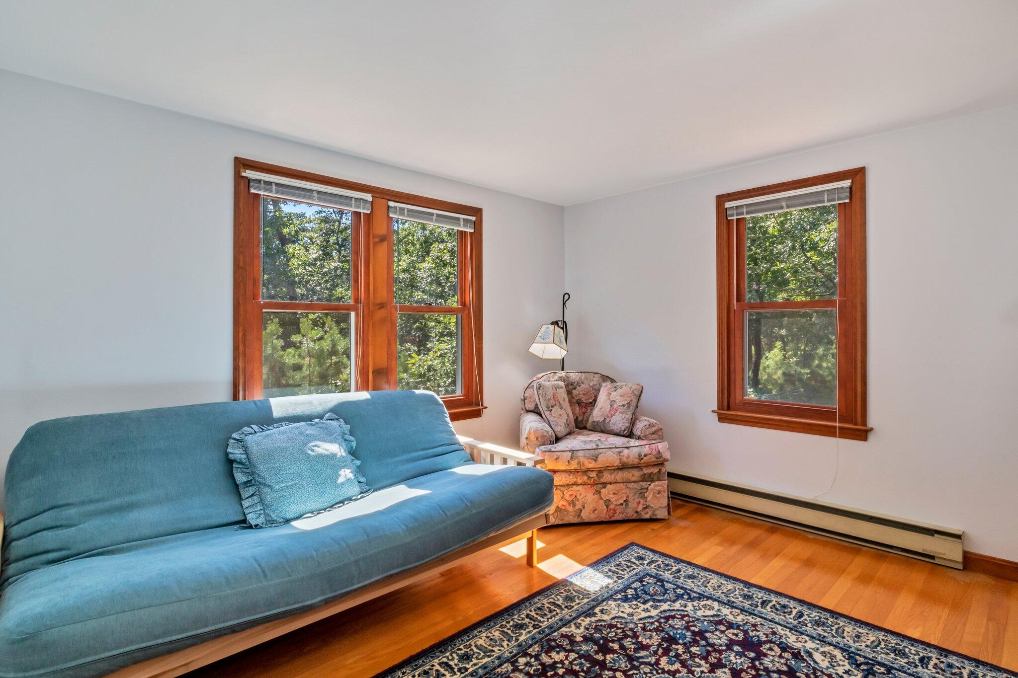 15 Chipmunk Lane Eastham, MA 02642 - Photo 16 of 32 a living room with furniture and a window