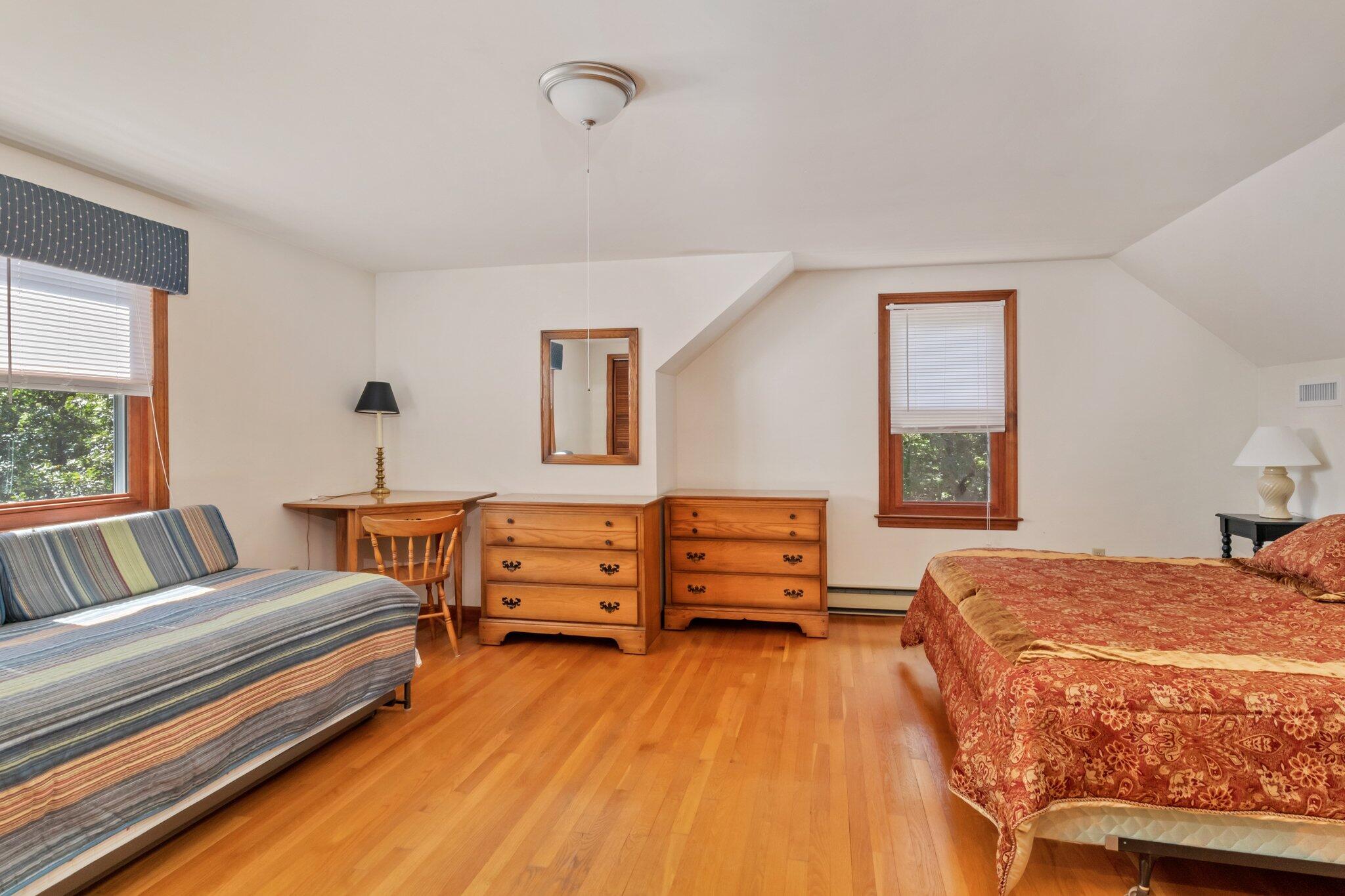 15 Chipmunk Lane Eastham, MA 02642 - Photo 17 of 32 a bedroom with a bed and a window