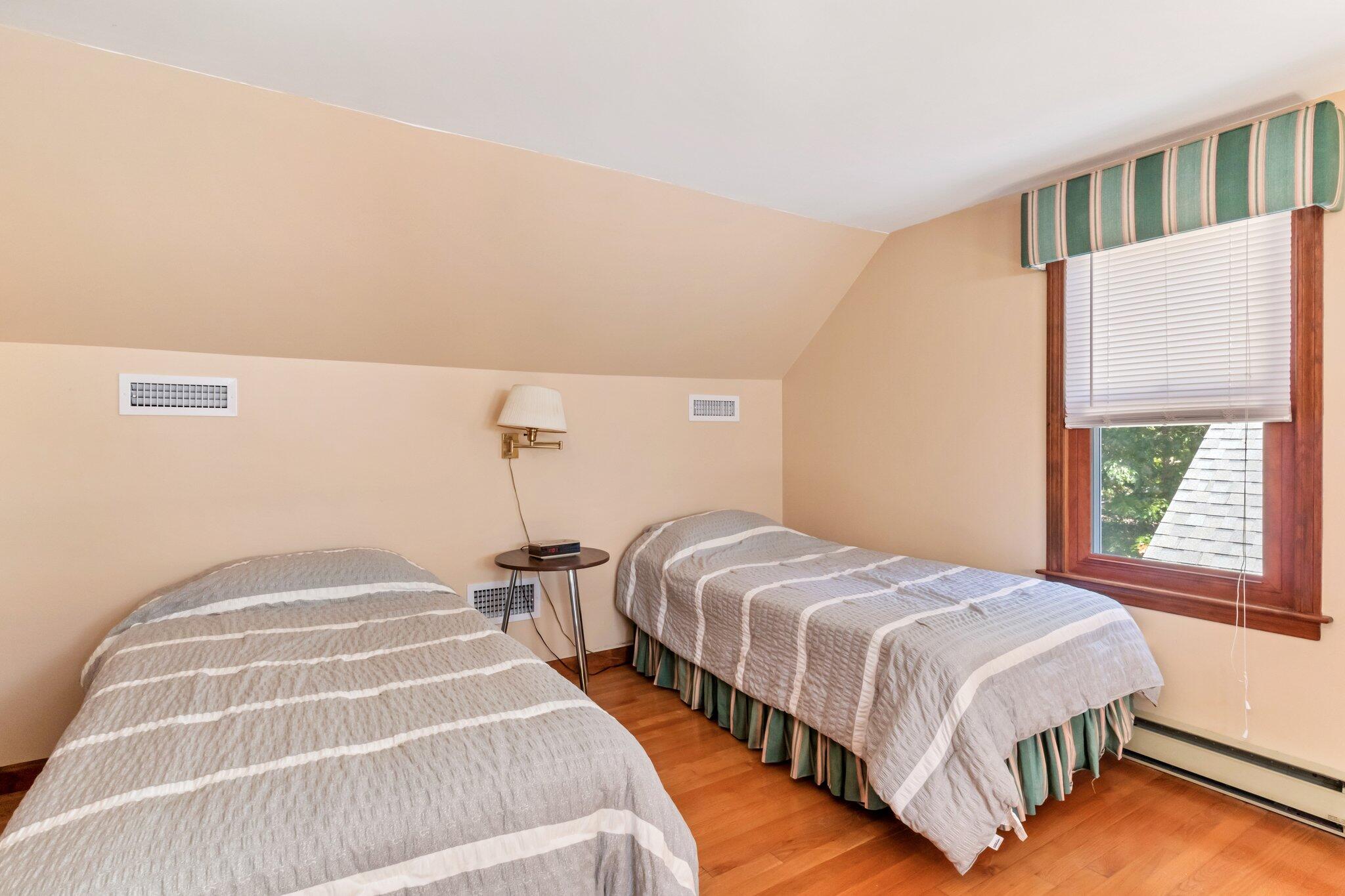 15 Chipmunk Lane Eastham, MA 02642 - Photo 21 of 32 a bedroom with two beds and a window