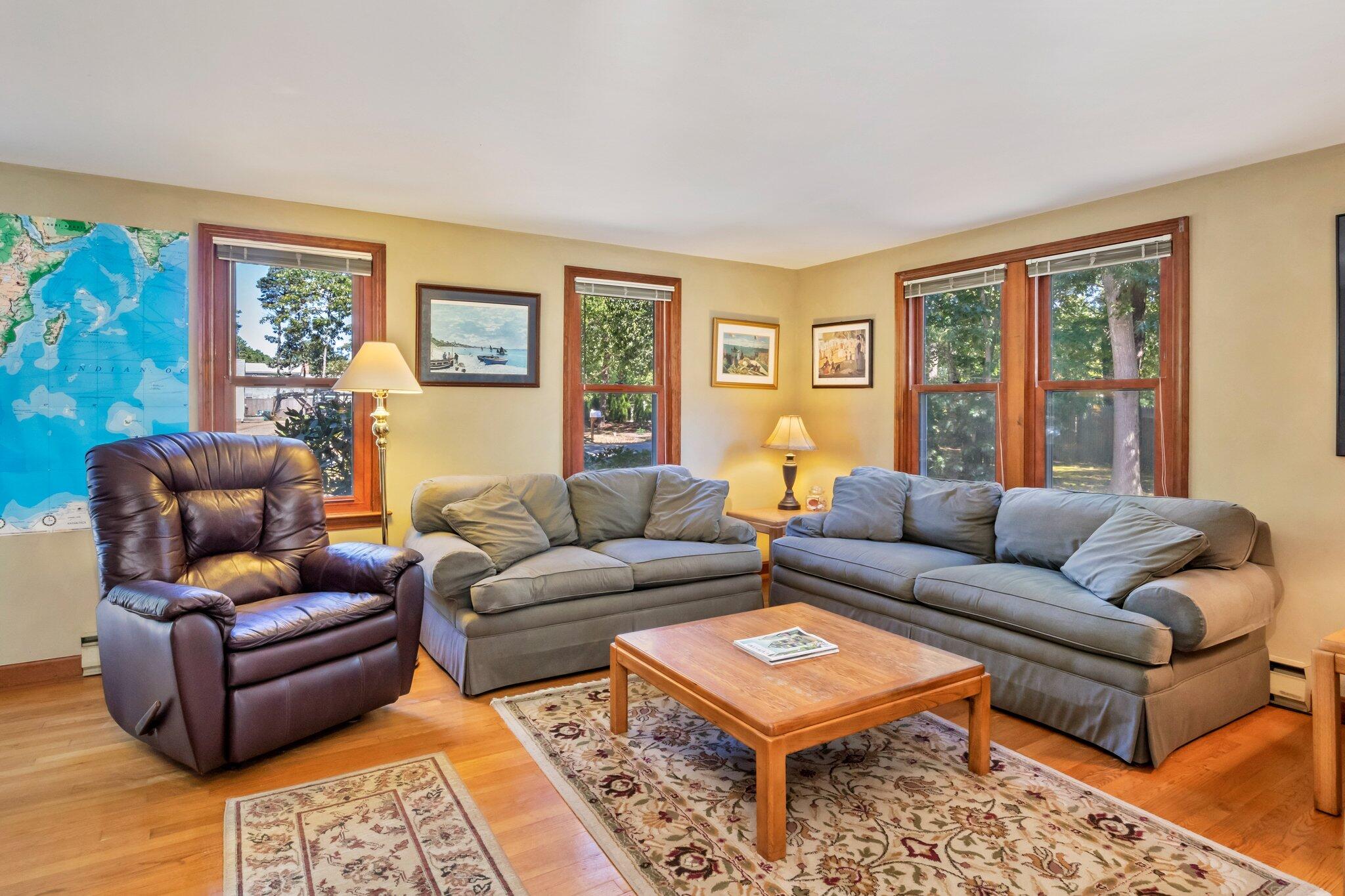 15 Chipmunk Lane Eastham, MA 02642 - Photo 5 of 32 a living room with furniture a rug and a window