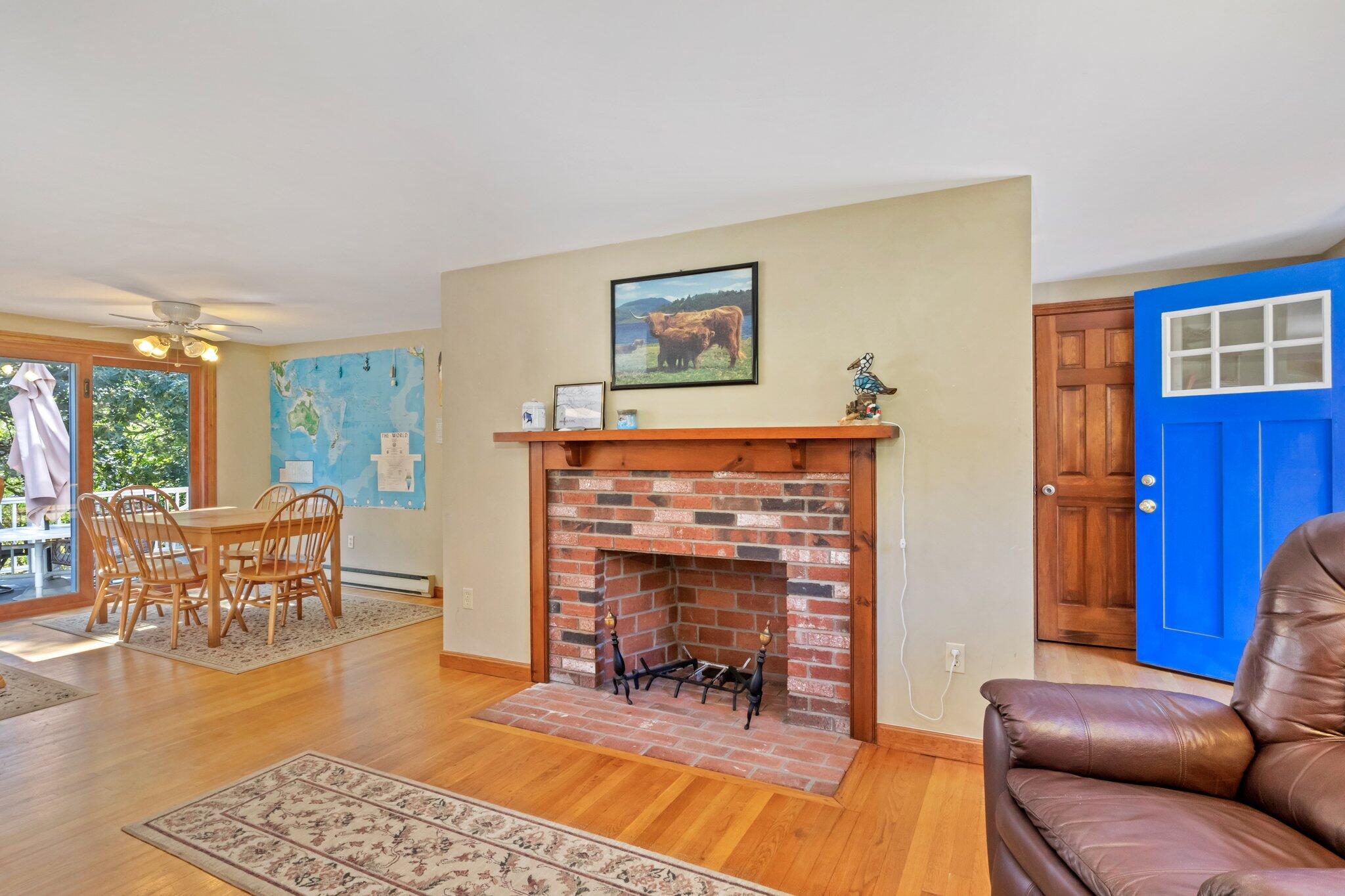 15 Chipmunk Lane Eastham, MA 02642 - Photo 6 of 32 a living room with furniture and a fireplace