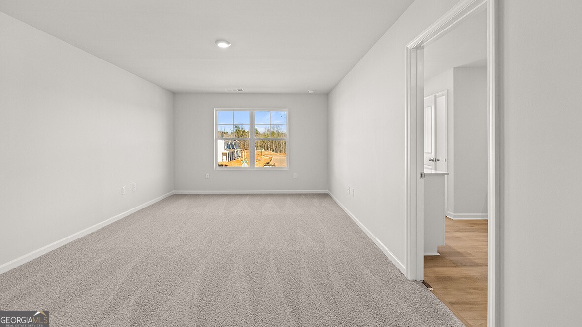 3253 Ryker Road, Unit 304 Gainesville, GA 30507 - Photo 15 of 32 an empty room with windows and closet