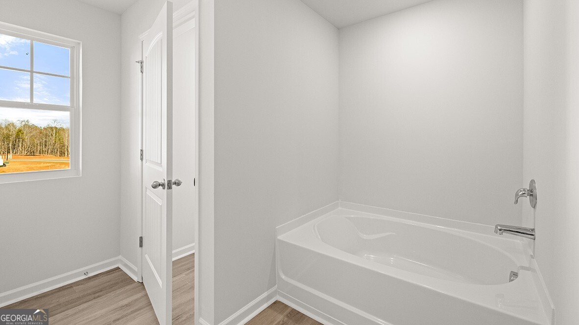3253 Ryker Road, Unit 304 Gainesville, GA 30507 - Photo 21 of 32 a white bath tub sitting next to a window