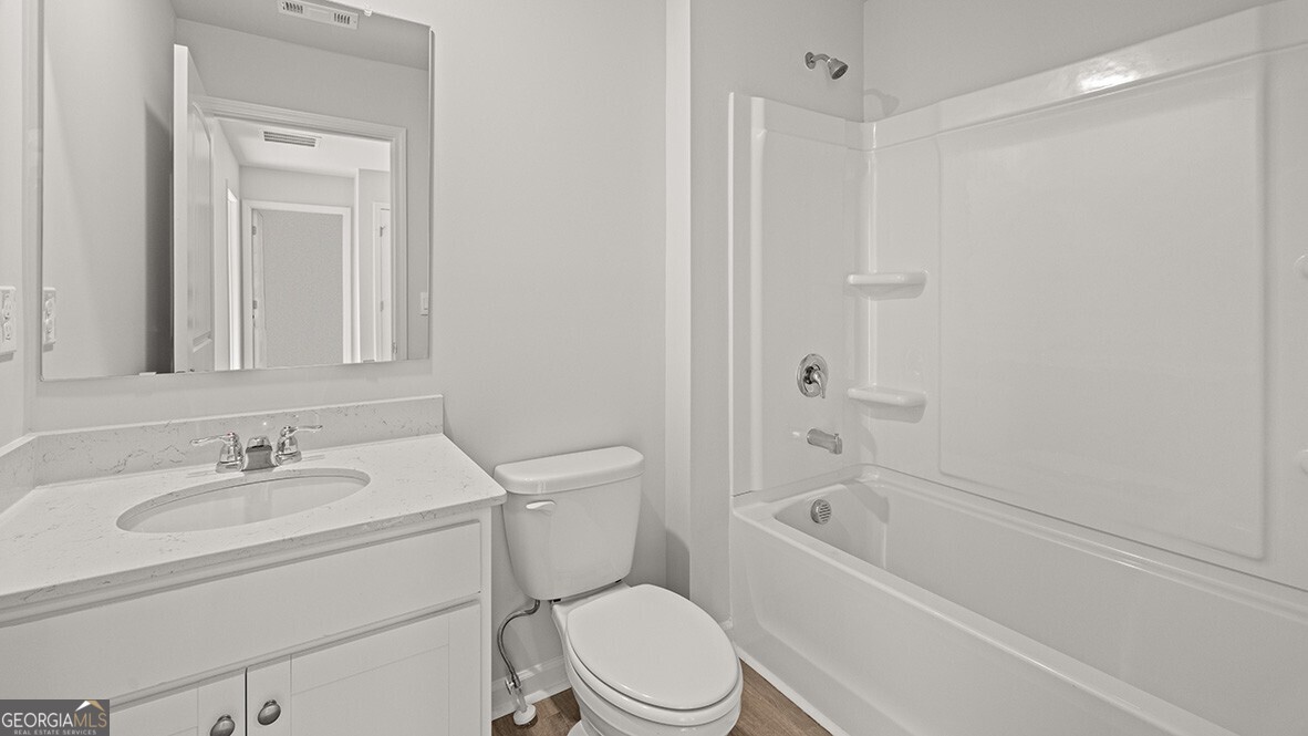 3253 Ryker Road, Unit 304 Gainesville, GA 30507 - Photo 24 of 32 a bathroom with a sink toilet and shower