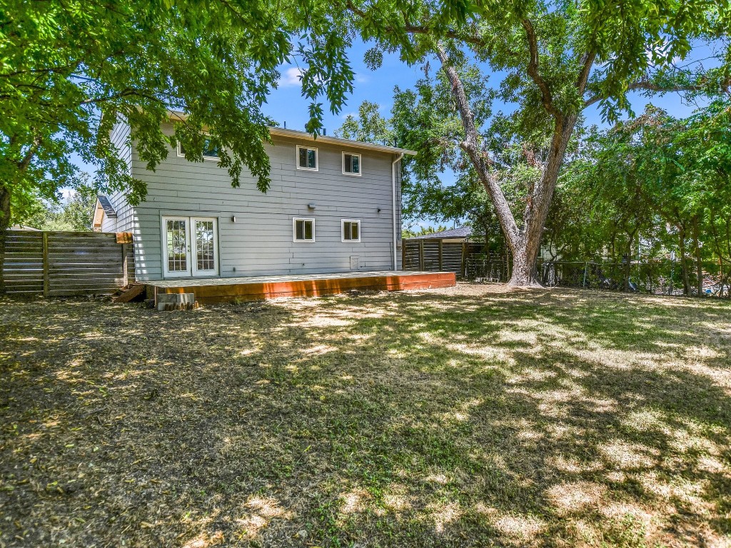 7617 Eastcrest Drive Austin, TX 78752 - Photo 19 of 20 a view of a house with a yard