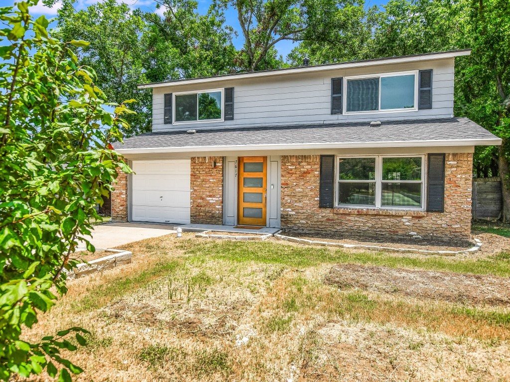 7617 Eastcrest Drive Austin, TX 78752 - Photo 2 of 20 a view of a house with a yard and large tree