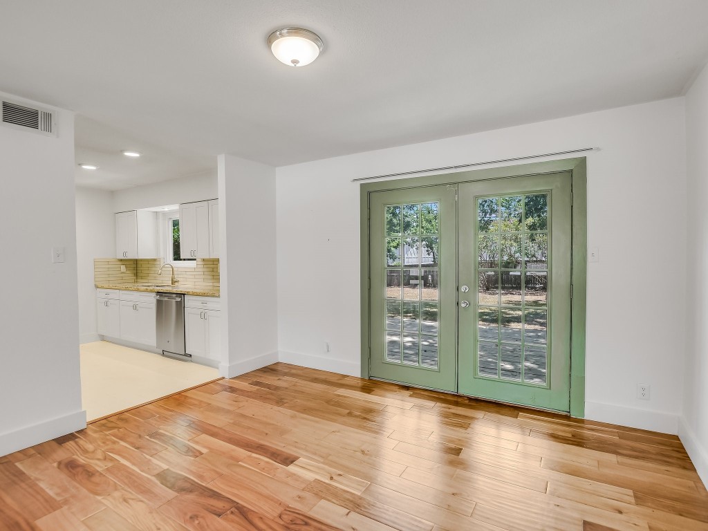 7617 Eastcrest Drive Austin, TX 78752 - Photo 6 of 20 a view of kitchen with furniture and wooden floor
