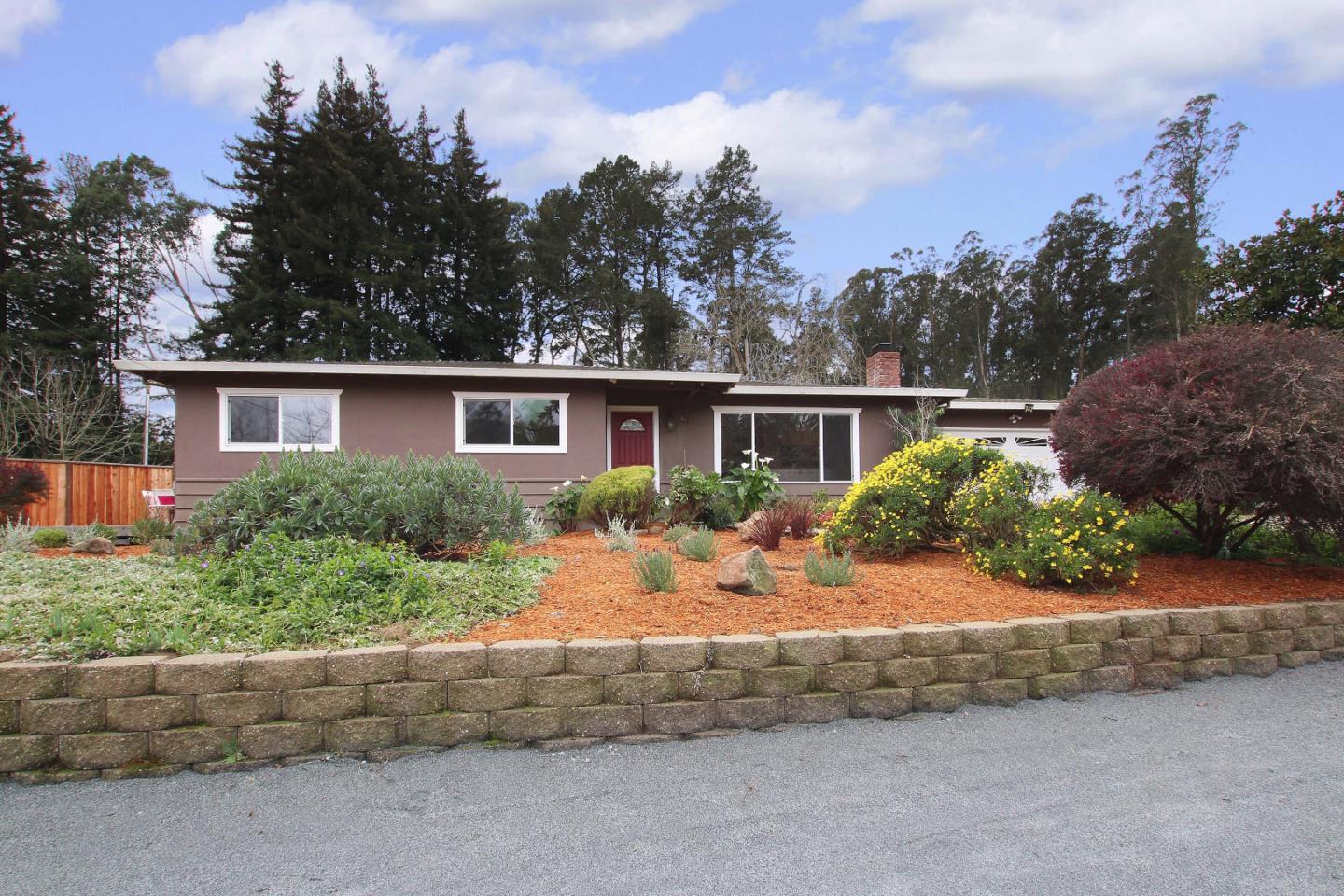 747 Calabasas Road Watsonville, CA 95076 - Photo 1 of 33 a front view of a house with a yard