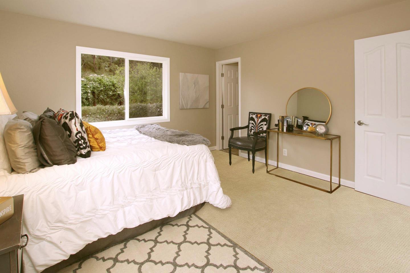 747 Calabasas Road Watsonville, CA 95076 - Photo 15 of 33 a bedroom with a bed and a chair