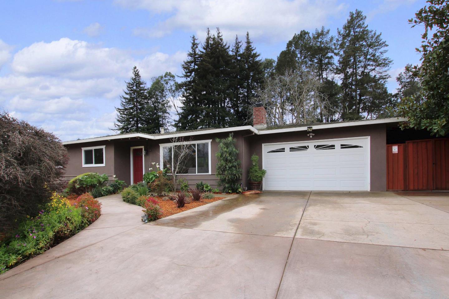 747 Calabasas Road Watsonville, CA 95076 - Photo 2 of 33 a front view of house with yard and trees in the background