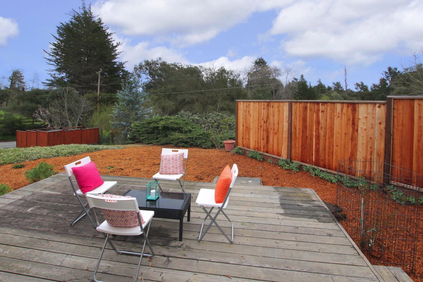 747 Calabasas Road Watsonville, CA 95076 - Photo 21 of 33 an outdoor sitting area with furniture and wooden floor
