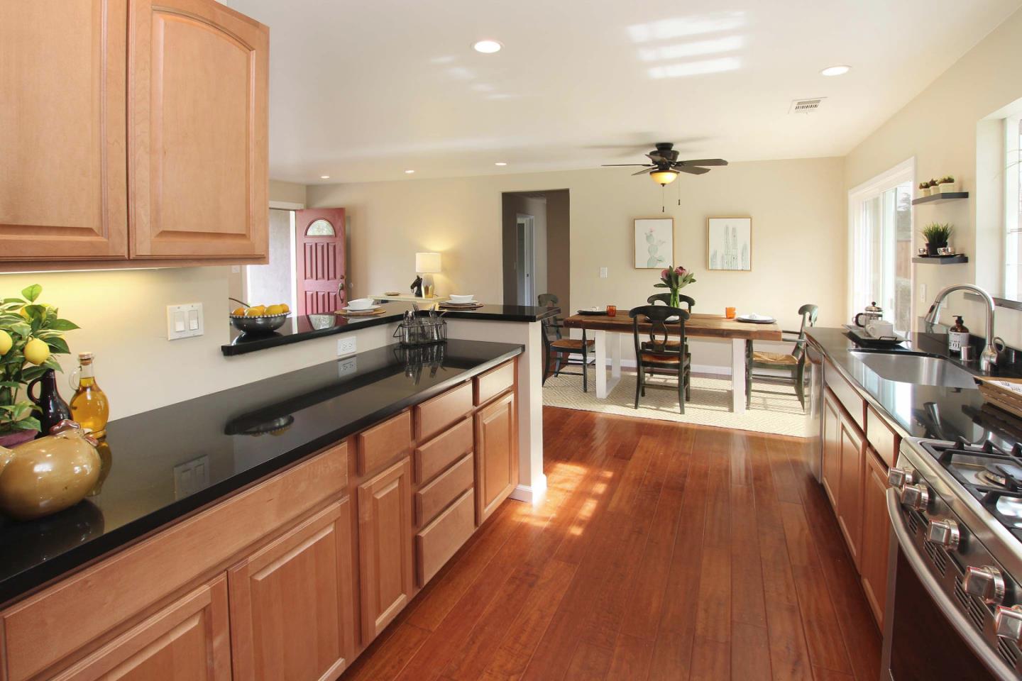 747 Calabasas Road Watsonville, CA 95076 - Photo 4 of 33 a kitchen with lots of counter top space and wooden floor