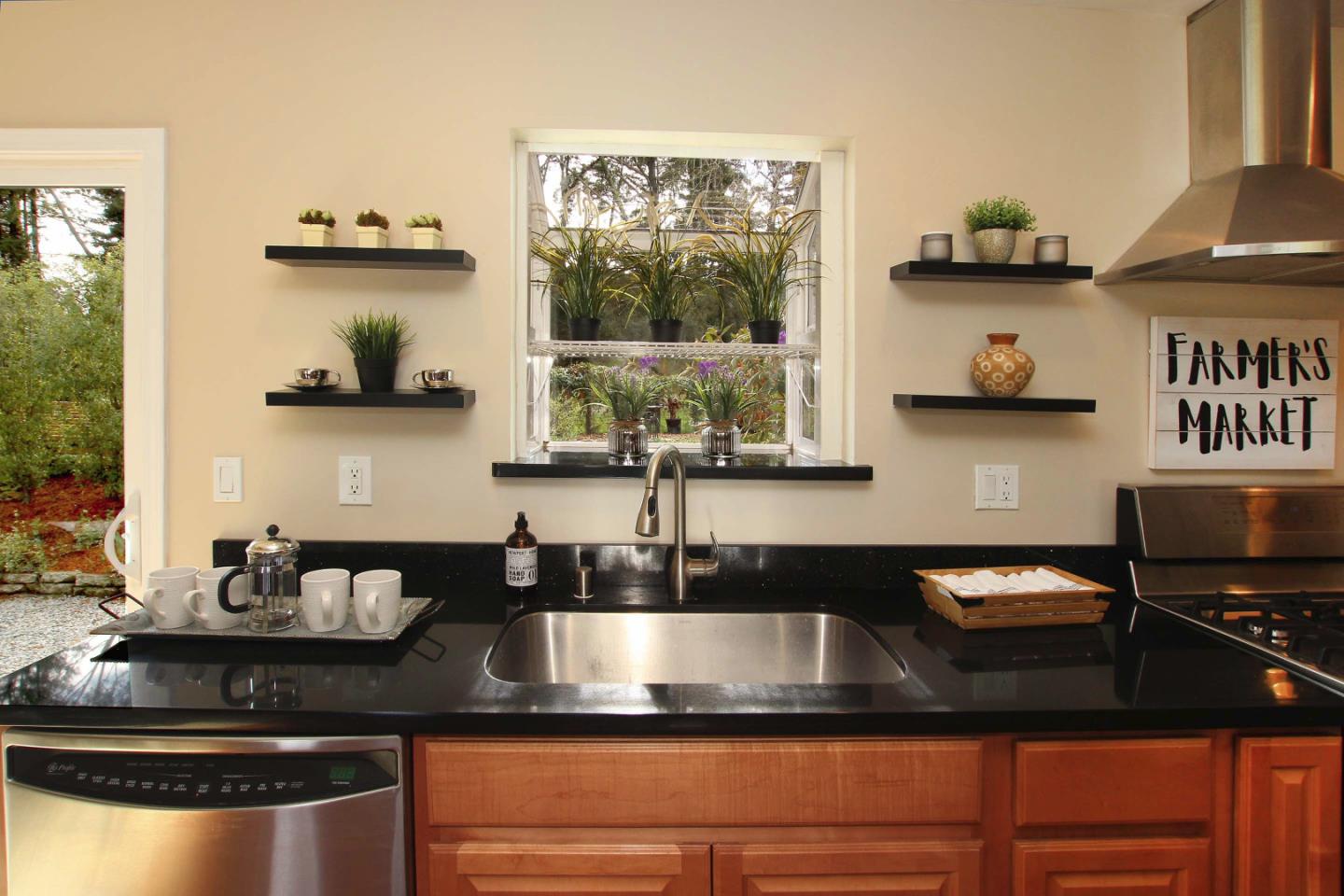 747 Calabasas Road Watsonville, CA 95076 - Photo 5 of 33 a kitchen with a sink and a stove
