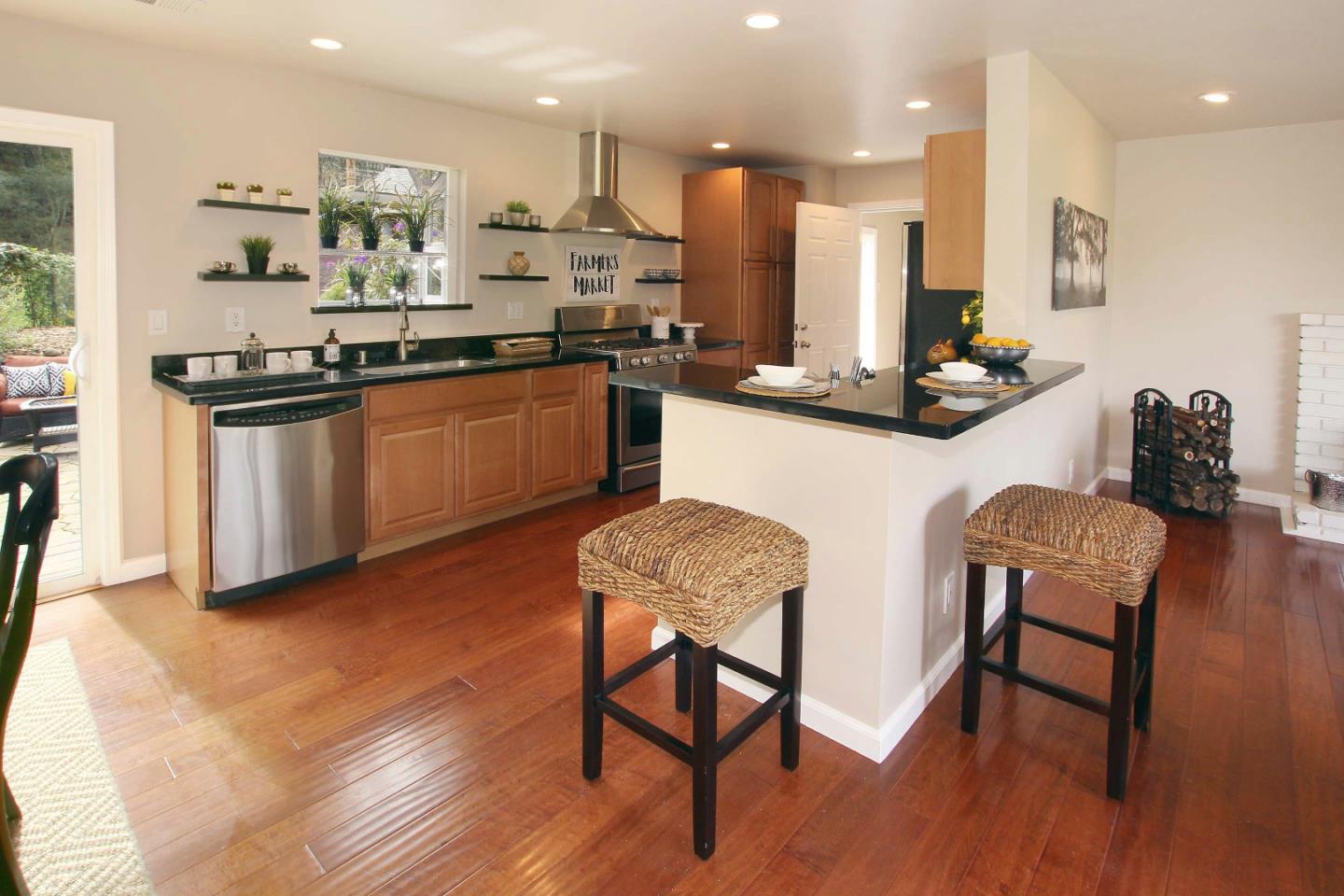 747 Calabasas Road Watsonville, CA 95076 - Photo 6 of 33 a kitchen with stainless steel appliances kitchen island granite countertop a sink and cabinets