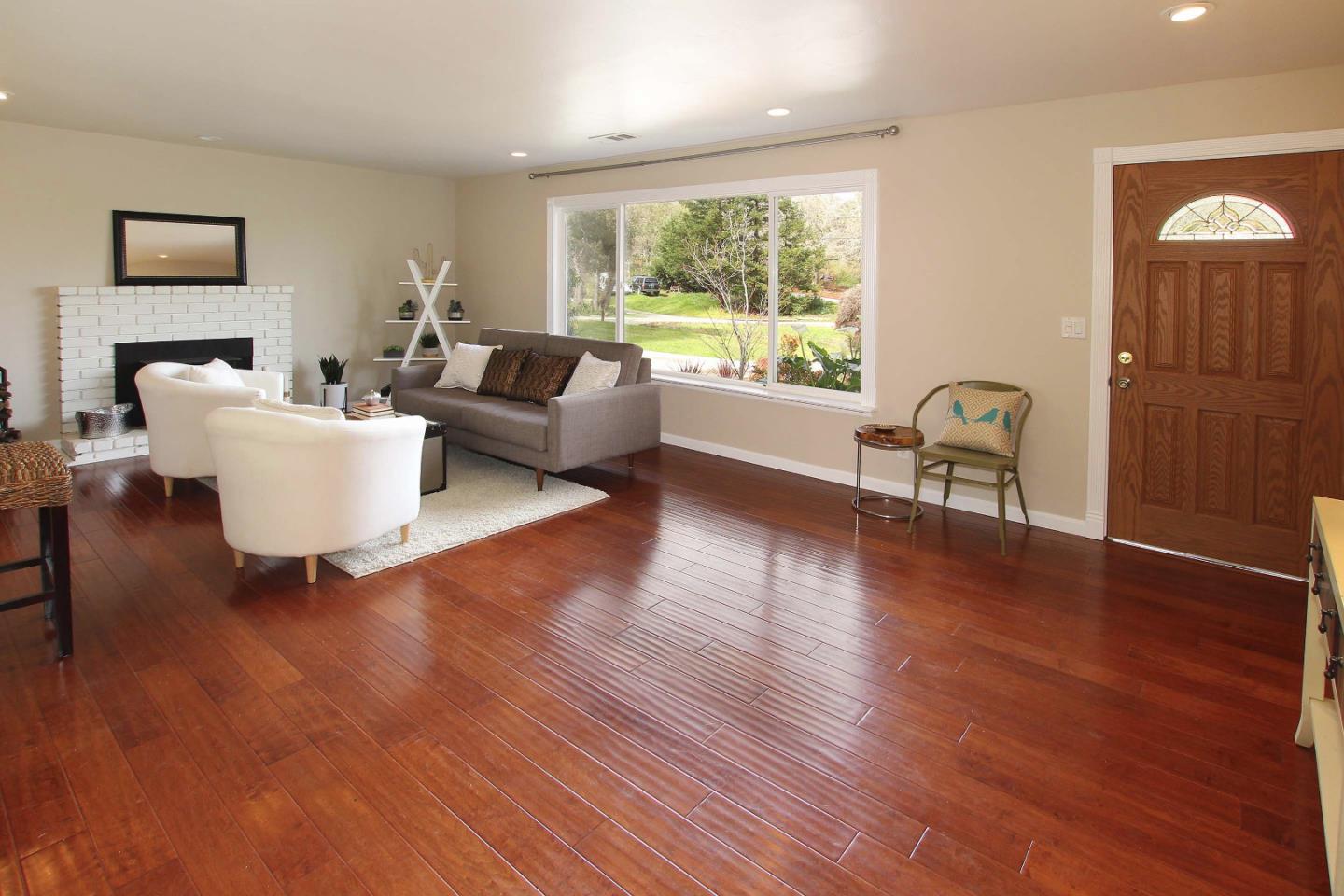 747 Calabasas Road Watsonville, CA 95076 - Photo 10 of 33 a living room with furniture and a wooden floor