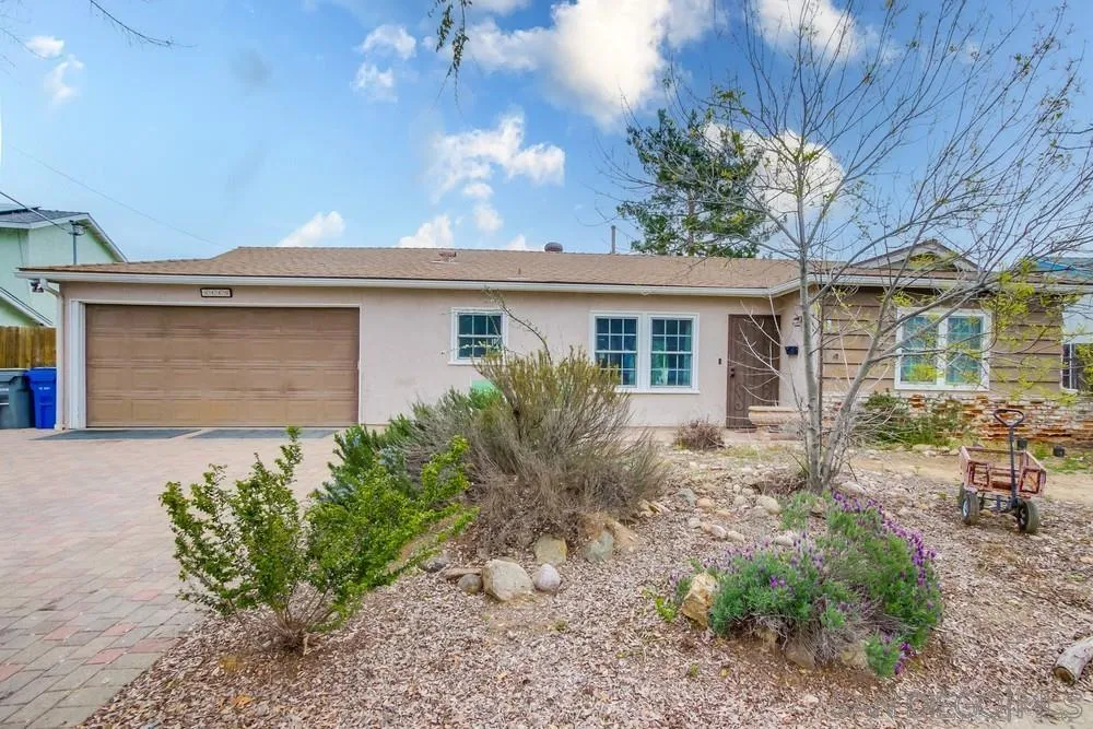 9449 Mandeville Road Santee, CA 92071 - Photo 2 of 20 a front view of a house with garden