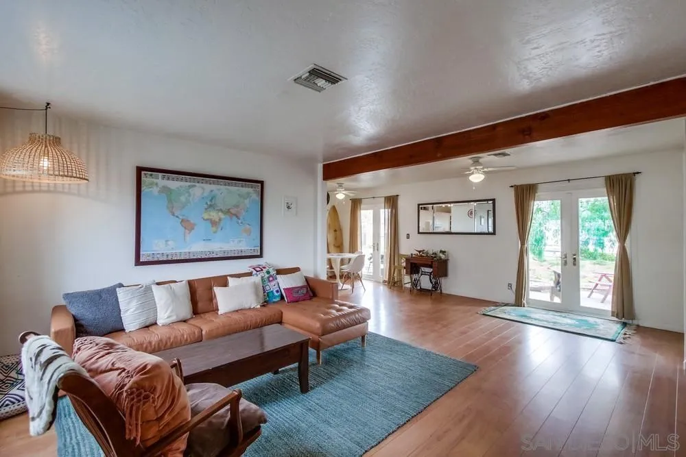 9449 Mandeville Road Santee, CA 92071 - Photo 3 of 20 a living room with furniture and a wooden floor