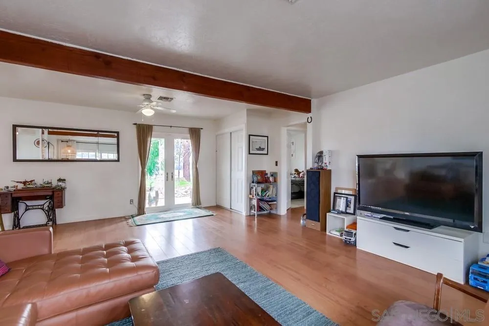 9449 Mandeville Road Santee, CA 92071 - Photo 4 of 20 a living room with furniture and a flat screen tv
