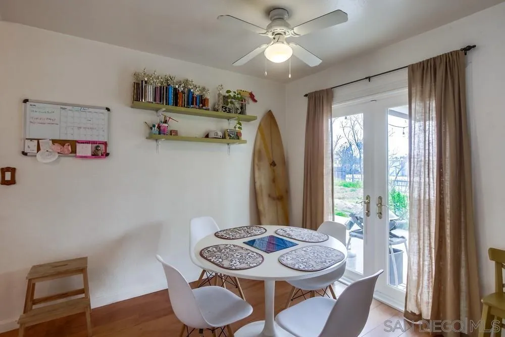 9449 Mandeville Road Santee, CA 92071 - Photo 7 of 20 a view of a dining room with furniture window and wooden floor