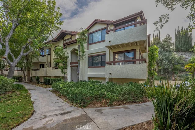 front view of a house with a garden