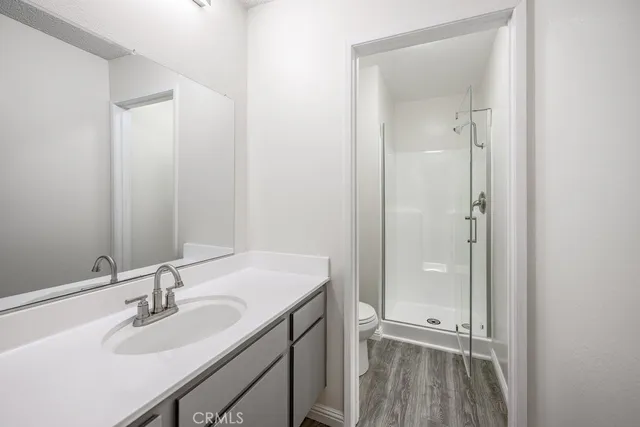 a bathroom with a sink a mirror and a shower