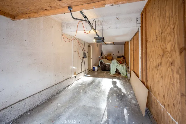 a view of a patio with table and chairs
