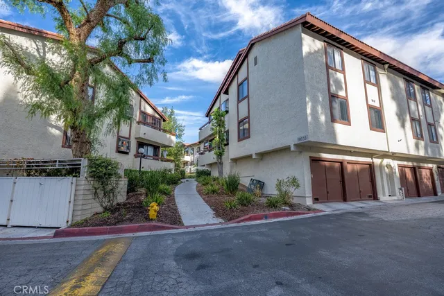 a view of a house with a street