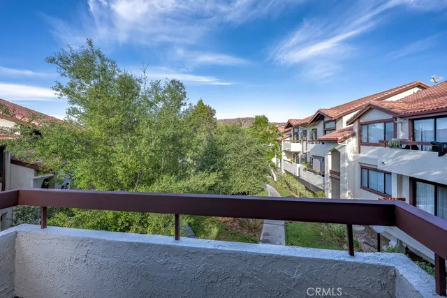 a view of a balcony with an outdoor space