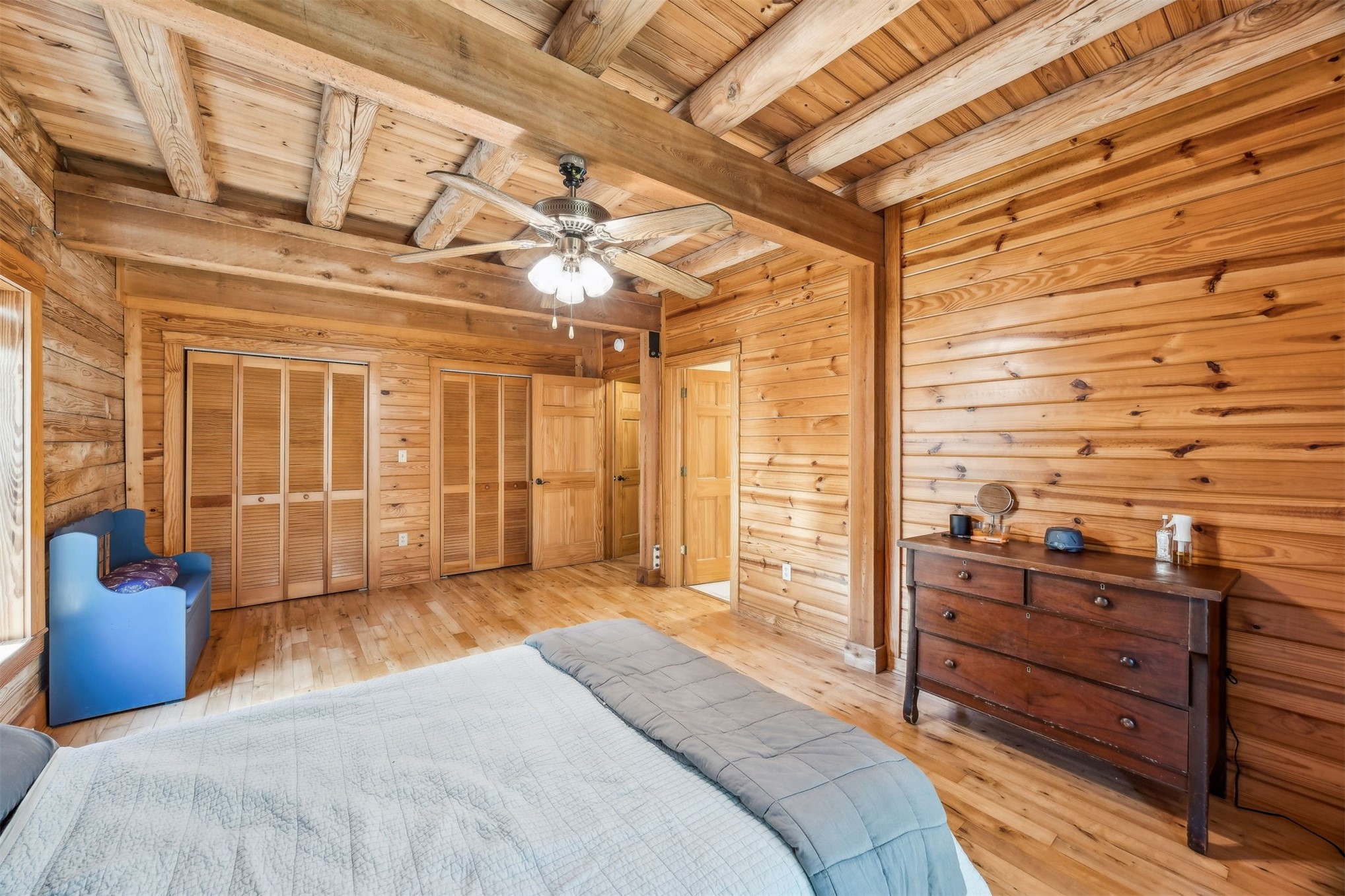 86205 Pages Dairy Road Yulee, FL 32097 - Photo 21 of 56 a bedroom with a bed and wooden floor