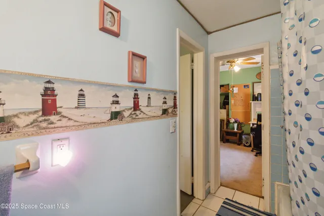 a en suite bathroom with a granite countertop sink and a mirror