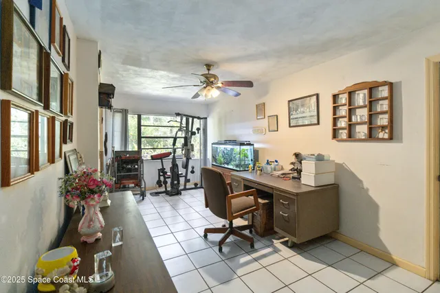 a view of a workspace with furniture and a livingroom