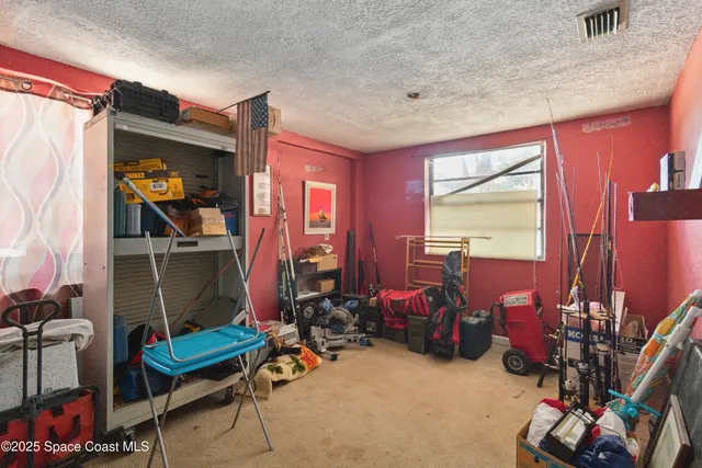 a room with furniture and gym equipment