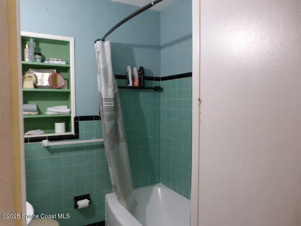 a bathroom with a tub and a sink