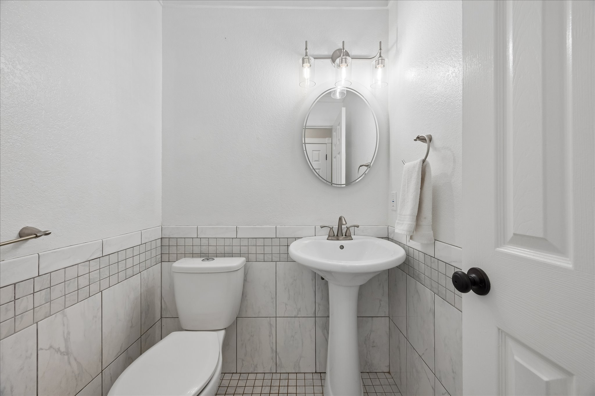 1306 Shady Grove Path Cedar Park, TX 78613 - Photo 16 of 40 a bathroom with a sink a toilet and mirror