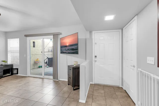 a bedroom with a large bed and a flat screen tv