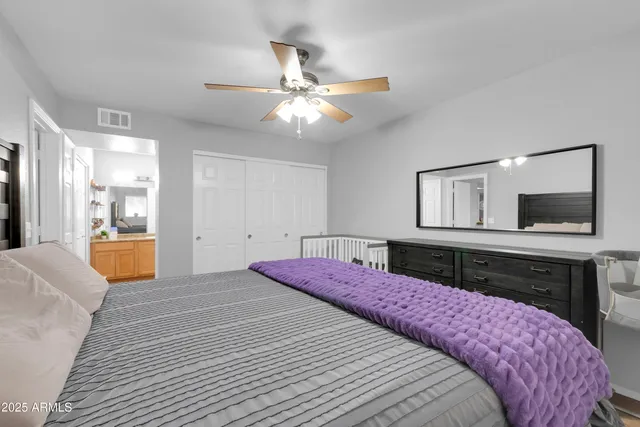 a bathroom with a double vanity sink and mirror