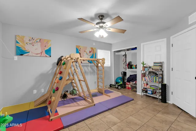 a dining room with furniture and chandelier