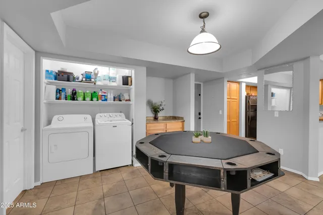 an aerial view of residential houses with outdoor space and swimming pool