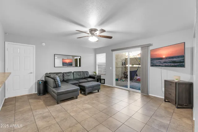 a kitchen with stainless steel appliances granite countertop a sink and a refrigerator