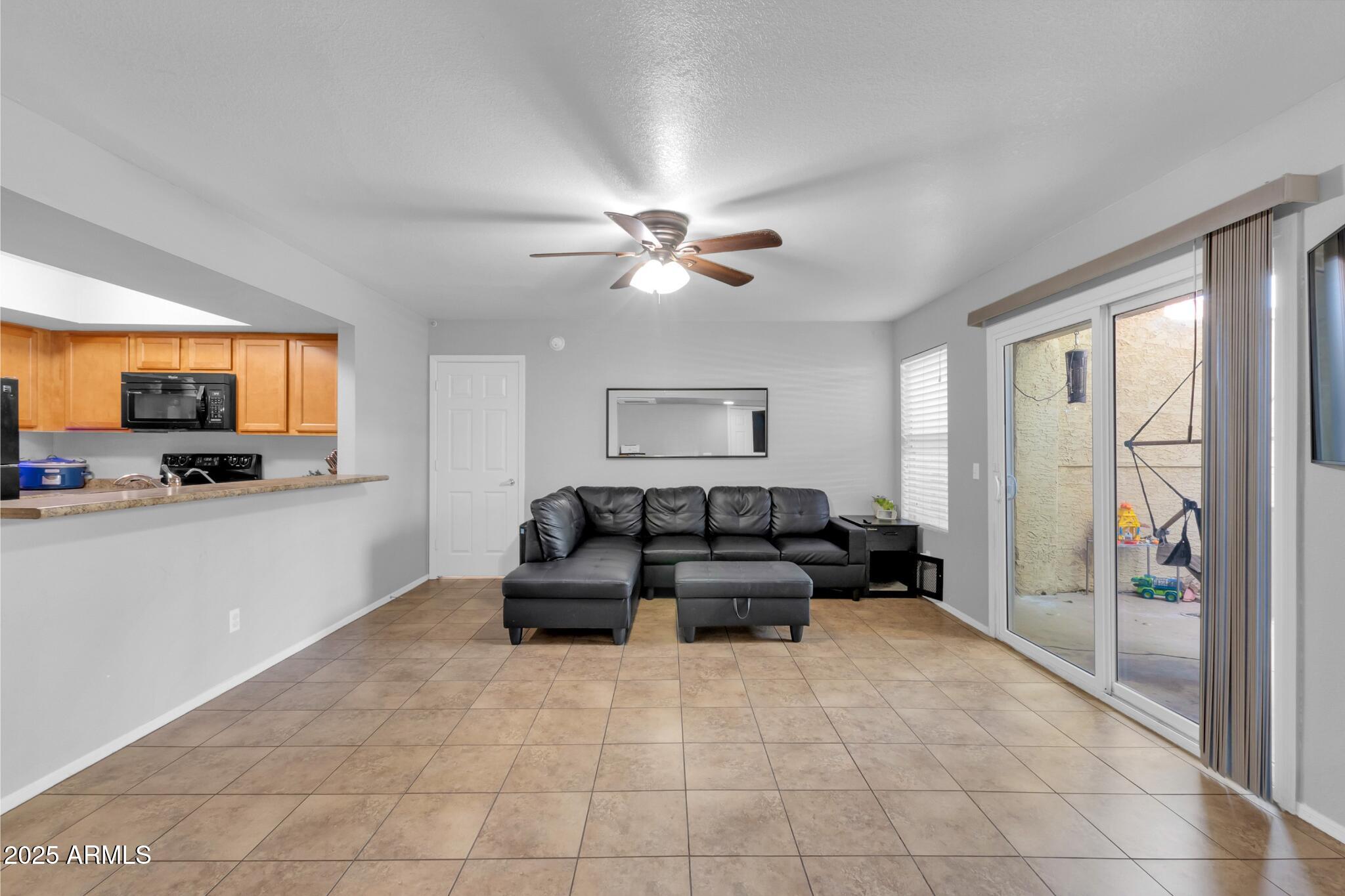 1331 West Baseline Road, Unit 148 Mesa, AZ 85202 - Photo 5 of 33 Living Room + Patio Entry