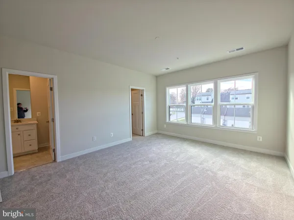 a bathroom with a double vanity sink toilet mirror and bathtub