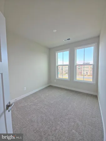 a front view of residential houses with street