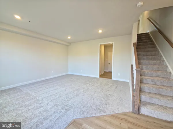 a view of hallway with wooden floor